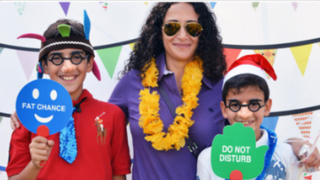 Family photo with mother and two sons at Splash N Bounce - Corporate Event and Party Planning in Dubai