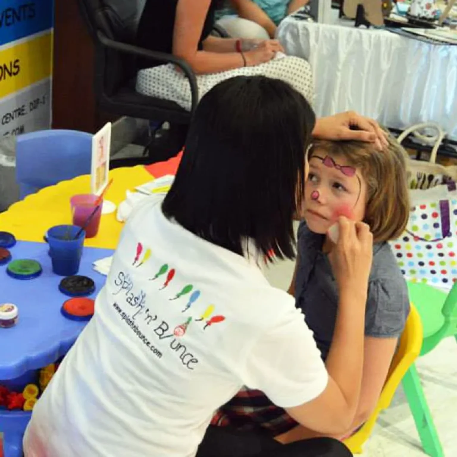 Face painting of kid by team at Splash N Bounce event management company in Dubai