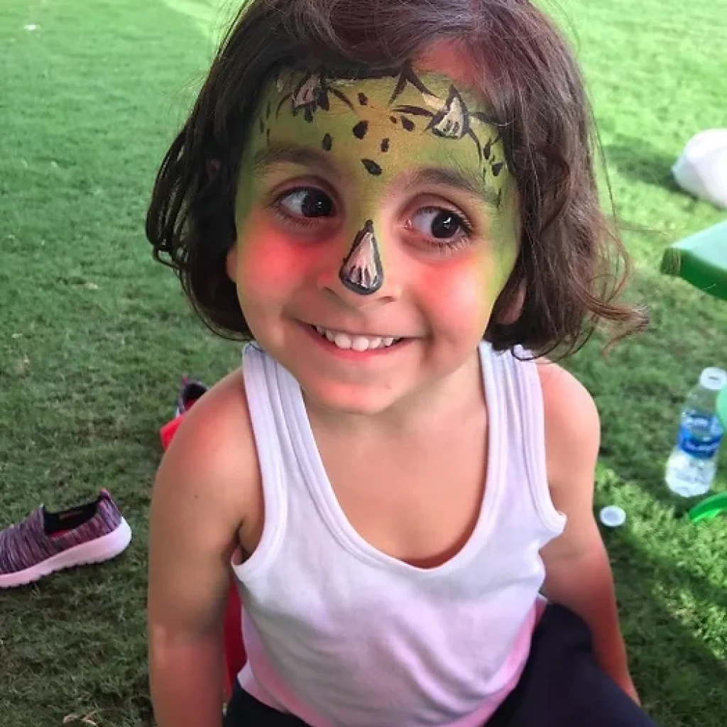 a kid happy with his face paint